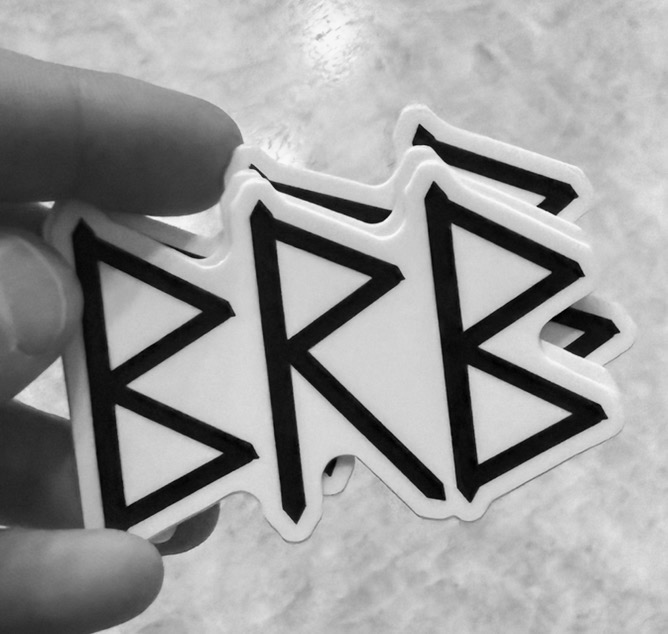 A stack of BRB die-cut stickers